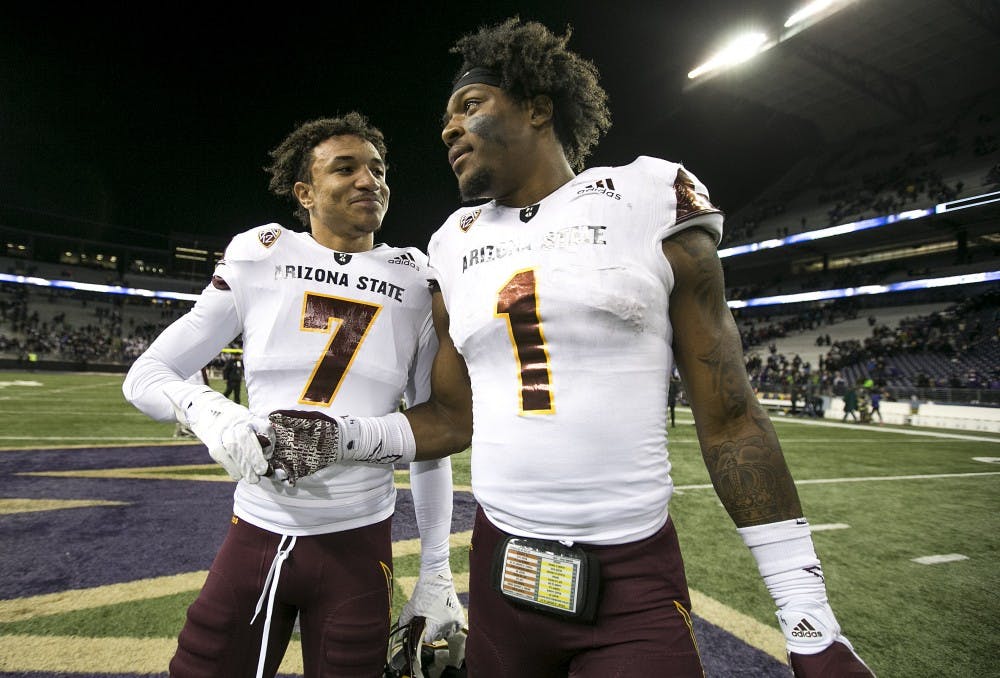 ASU Sun Devils defensive back Chase Lucas (7) and ASU Sun Devils wide receiver N'Keal Harry (1) walk off the field after a football game against the UW Huskies on Saturday, Nov. 19, 2016, in Husky Stadium in Seattle, Washington. 