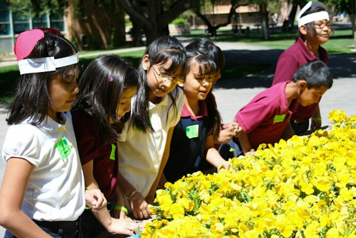 PLAY TIME: Students from Creighton Elementary School in Phoenix play at a lunch break during their visit to the ASU Tempe campus earlier in the week. (Photo by Lisa Bartoli)