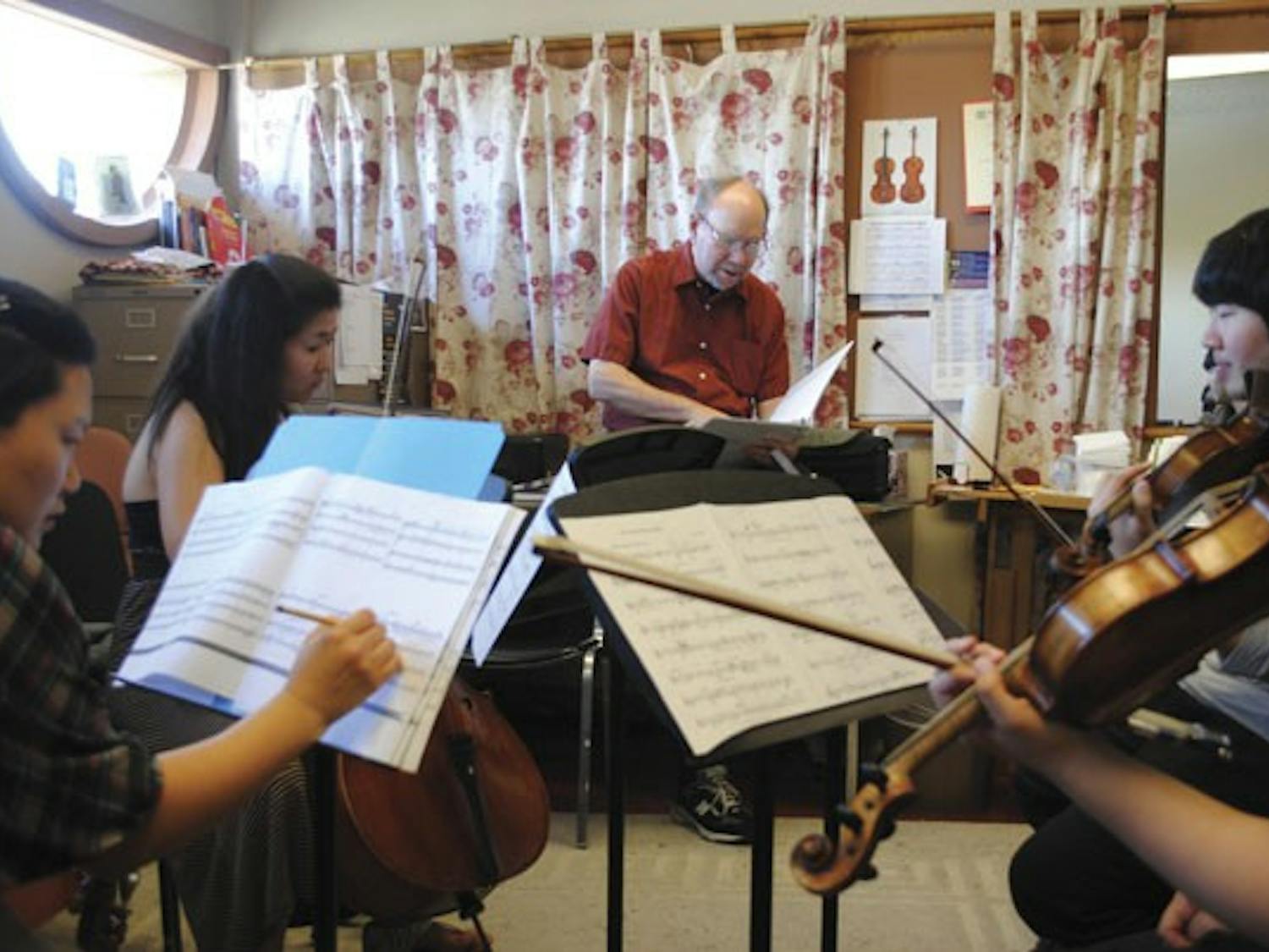 Juilliard String Quartet violist Samuel Rhodes helps Herberger students rehearse a quartet by music composition junior Garrett Miller to prepare for the Phoenix Art Museum's annual ASU Composers Concert.
(Photo by Yvonne Gonzalez)