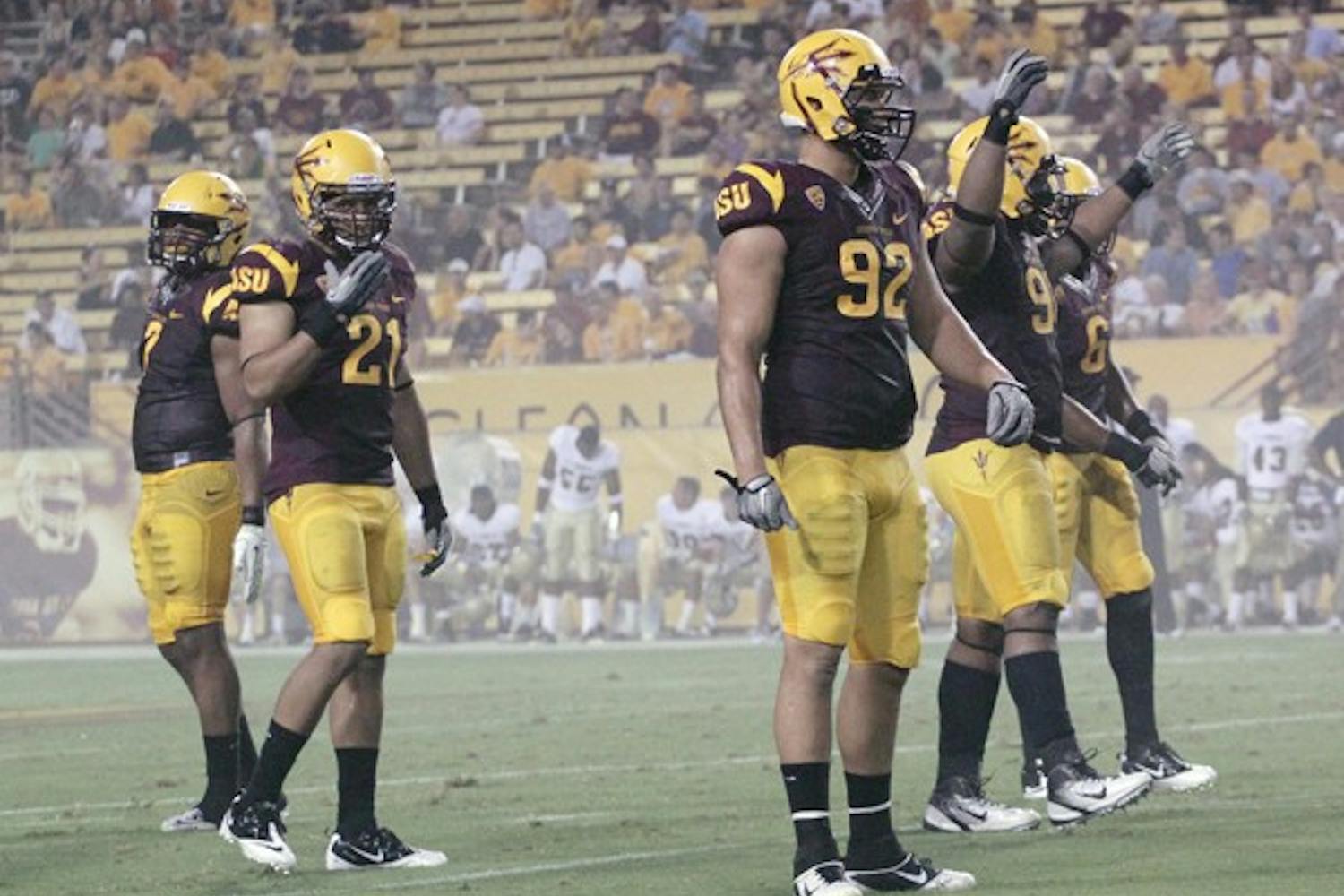 UNDER THE RADAR: ASU redshirt senior linebacker Colin Parker (21) looks to the sideline during the Sun Devils’ victory over UC Davis on Sept. 1. Parker has been the unsung leader of the ASU defense all season. (Photo by Beth Easterbrook)