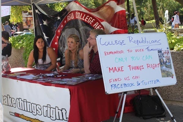 VOTE TODAY: Members of the ASU College Republicans sit outside the Memorial Union encouraging students to head to the polls on Nov. 2. (Photo by Rosie Gochnour)