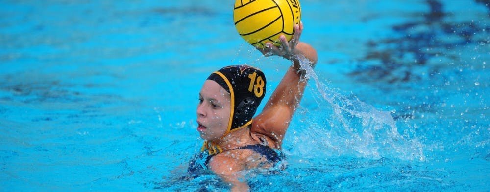 Junior attack Petra Pardi passes to an open teammate in a match against USC on March 1. (Photo by Mario Mendez)