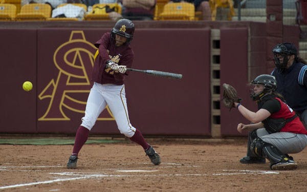 WHACK IT OUTA HERE: Junior outfielder/first baseman Dani Rae Lougheed goes for a hit in last week's game against Rutgers. (Photo by Michael Arellano)