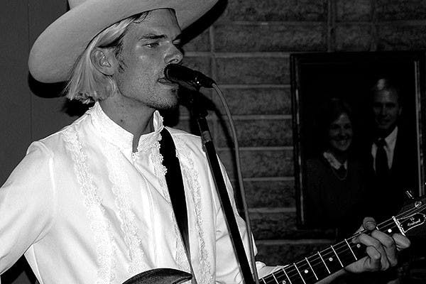 Nick Neihardt sings and plays the guitar at a show. (Photo by Keerthi Vedantam)