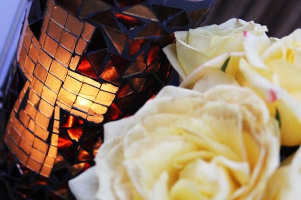 Candles line the sidewalk to guide the homeless to a warm meal at the Apprenticeship to Jesus Phoenix prayer house on Saturday. (Photo by Ana Ramirez)