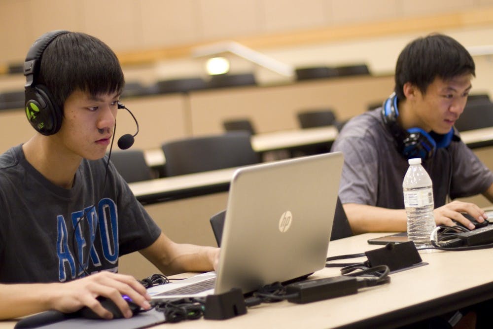 ASU League of Legends Club members freshmen Matthew Chau and Anthony Chau warm up by practicing before the LAN Event held in the Education C-Wing Building in Tempe, Arizona, on Wednesday, Sept. 22, 2016. 
