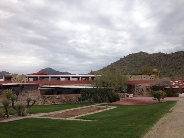 An outside view of the guest rooms (top floor), dining room and drafting rooms (first floor). The drafting rooms are still used by students to create building designs. Photo courtesy of Holly Solis