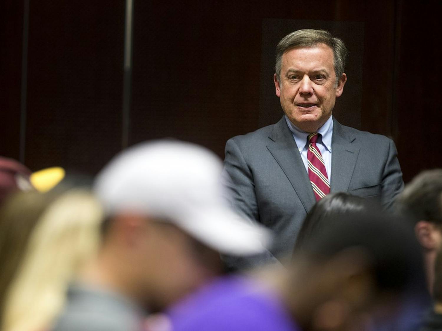 ASU President Michael Crow looks around the room after arriving to a student forum hosted by USG in the MU on Thursday, March 23, 2017. 