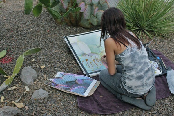 COLORS OF THE WIND: Junior painting major Marissa Wolfosn is getting real life inspiration for her artwork on the ASU campus. (Photo by Rosie Gochnour)