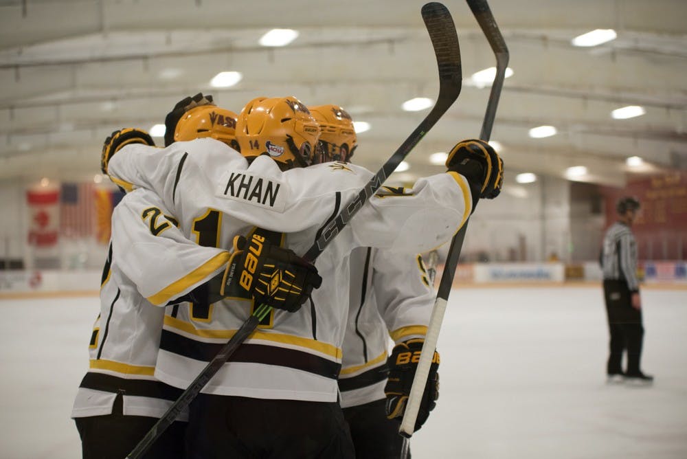 ASU's Ryan Belonger (22), Faiz Khan and David Norris celebrate the Sun Devils' first ASU goal of the evening on Jan. 22, 2015, at Oceanside Arena in Tempe.