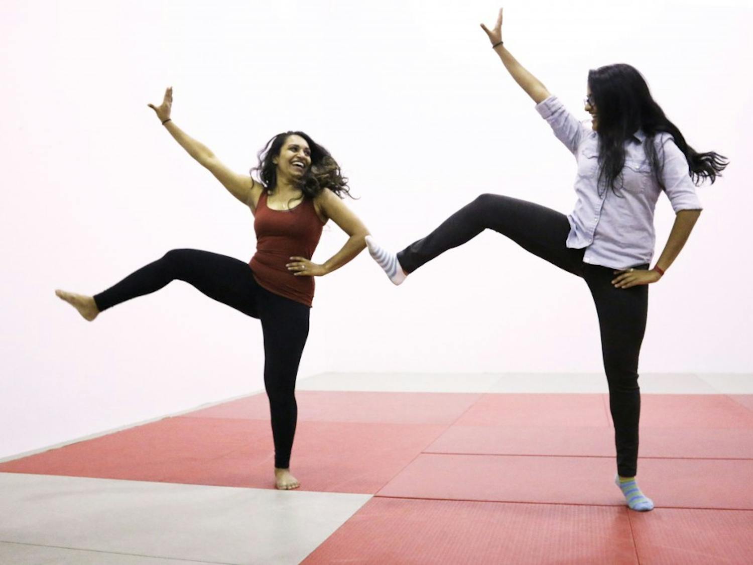 Kanak Jha, broacast journalism senior, and Bhavna Ramesh, biomedical engineering sophomore, practice their Bollywood dance at the Sun Devil Fitness Center on Monday Oct. 24, 2016. 
