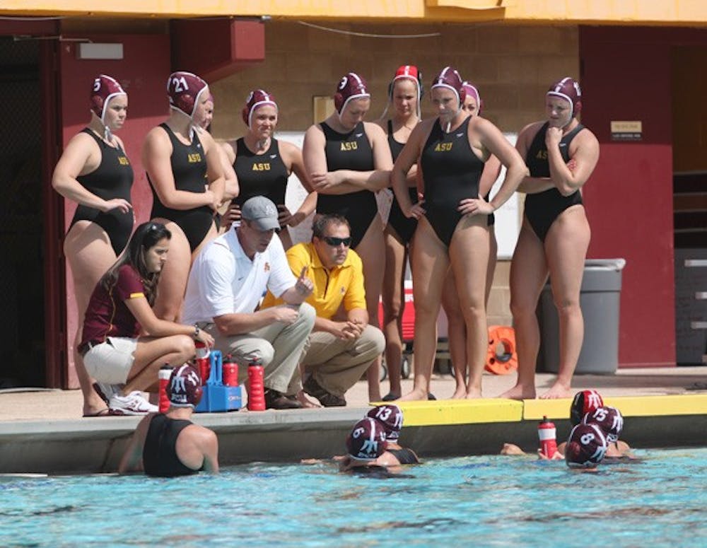 Trial by fire: The ASU water polo team gathers around as coach Todd Clapper talks strategy during the game against Cal on March 5. Playing in the tough MPSF conference has helped the Sun Devils become a top-10 team. (Photo by Beth Easterbrook)