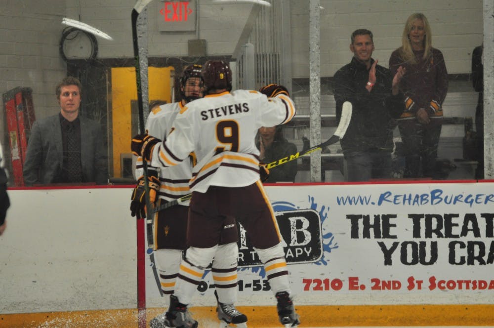 Freshman forward Ryan Stevens celebrates an ASU goal with a teammate at Oceanside Ice Arena in Tempe in ASU hockey's 7-1 win over Southern New Hampshire on Oct. 24, 2015.