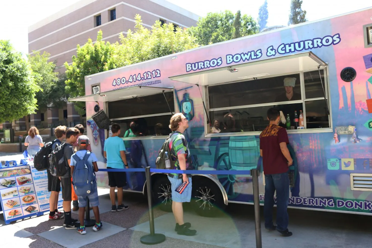 ASU students wait in line to buy food at the Wandering Donkey food truck on the West campus on Sept. 6, 2016.