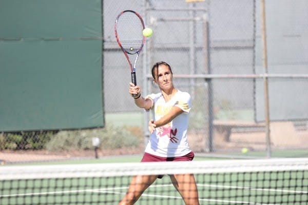 Freshman Stephanie Vlad returns the ball during practice on Sept. 19. (Photo by Kyle Newman)