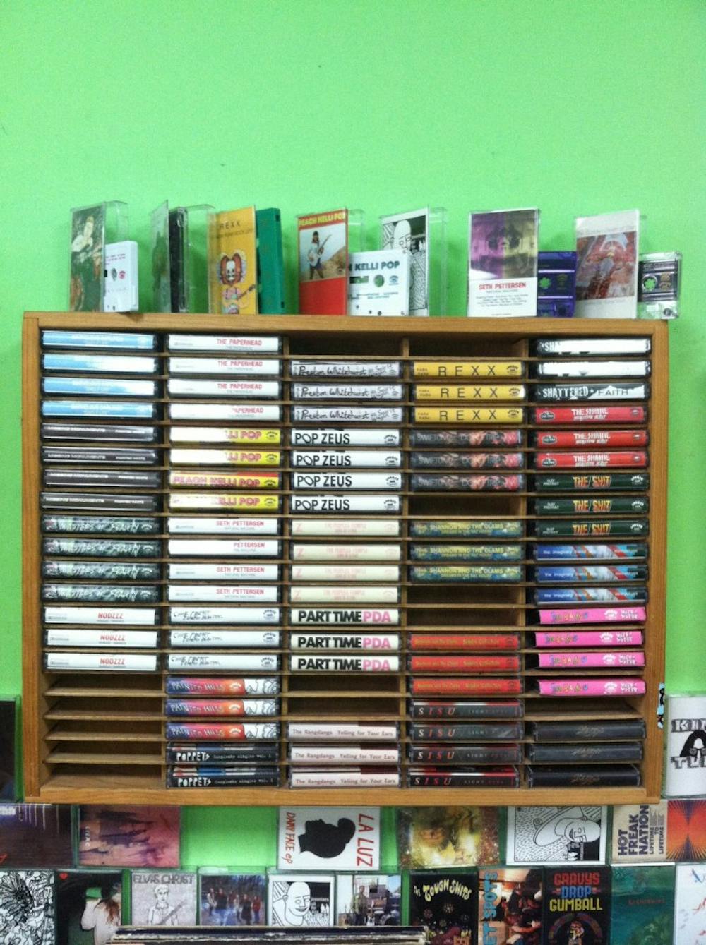 Racks of cassette tapes are found at Burger Records  in Fullerton Calif. Many bands that Burger Records carries intentionally release music on cassette tapes because of their rising popularity. (Photo by Maggie Spear) 
