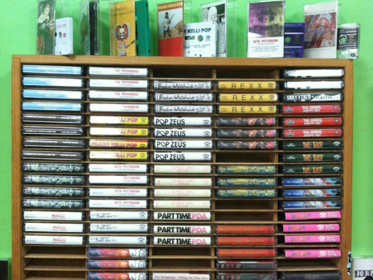 Racks of cassette tapes are found at Burger Records  in Fullerton Calif. Many bands that Burger Records carries intentionally release music on cassette tapes because of their rising popularity. (Photo by Maggie Spear) 