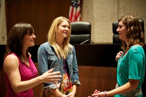 ALL LAW-YERED UP: Lauren burke, center, works late into the evening with fellow first-year graduate students in the Sandra Day O'Conner College of Law. On monday, a national lawyer and judge summit was held here to discuss the future of law education. (Photo by Michael Arellano)
