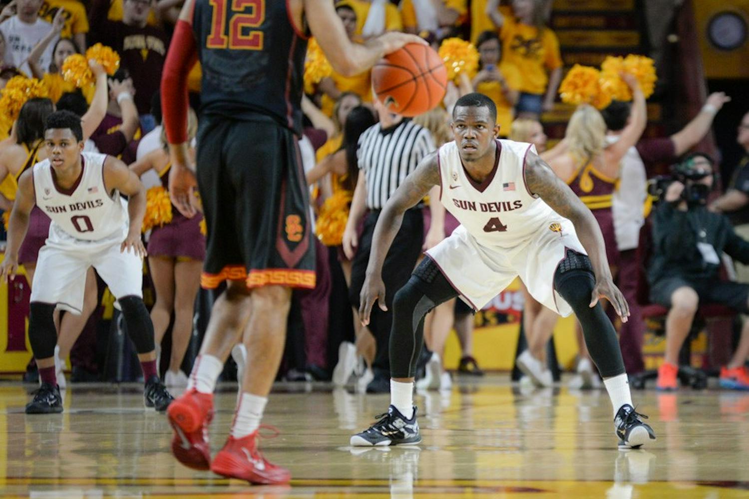 Junior guard Gerry Blakes stands formidably against the USC offense on Feb. 22, 2015, at the Wells Fargo Arena. The strong defense by Blakes and the entire Sun Devil team along with keen with a offense would lead the Sun Devils to a 64-59 victory over the Trojans. (J. Bauer-Leffler/The State Press)