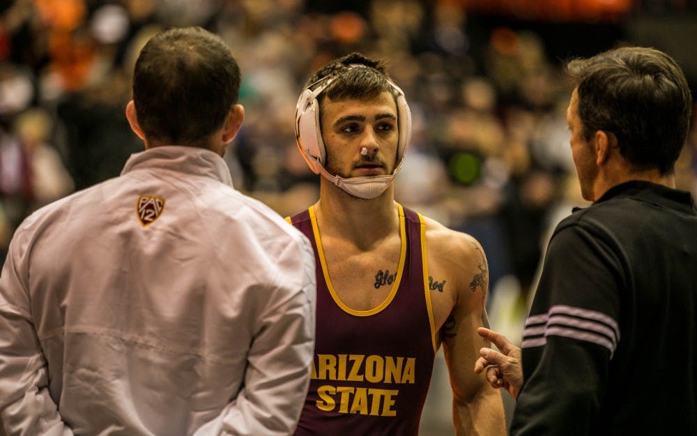 Elite opponents and heavy road schedule keep ASU wrestling battle