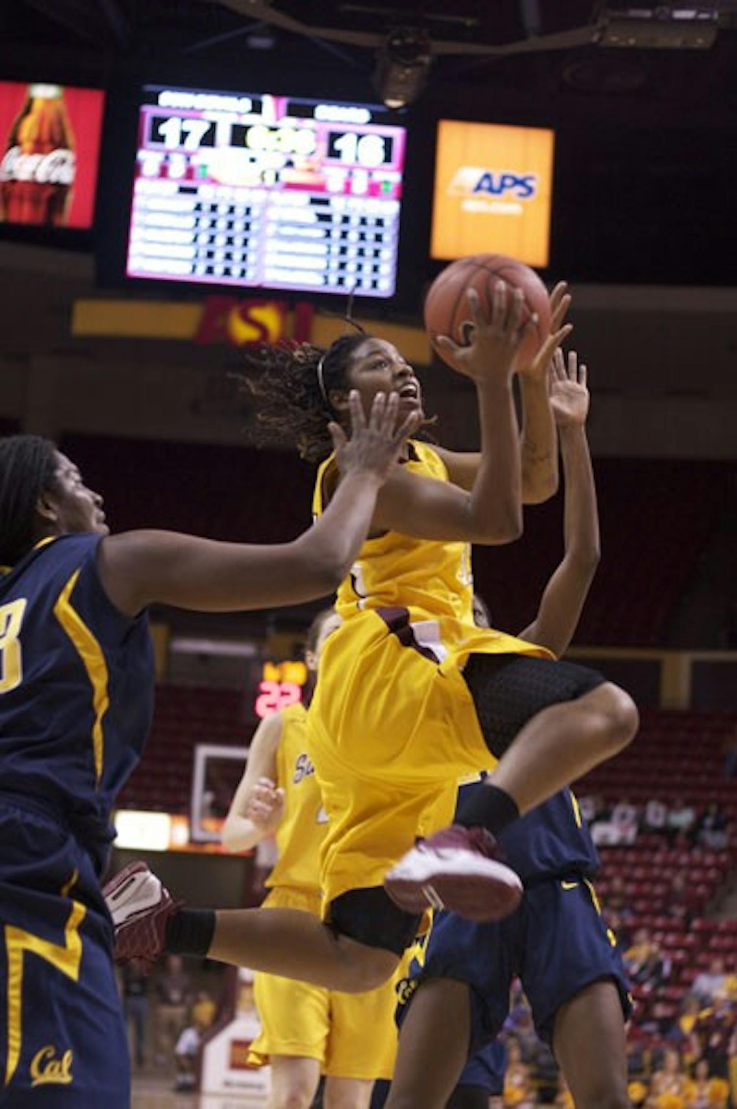SOARING BY: Junior guard Tenaya Watson goes for a layup in between two California defenders in the Sun Devils’ 57-50 win over the Golden Bears Saturday afternoon at Wells Fargo Arena. (Photo by Scott Stuk)