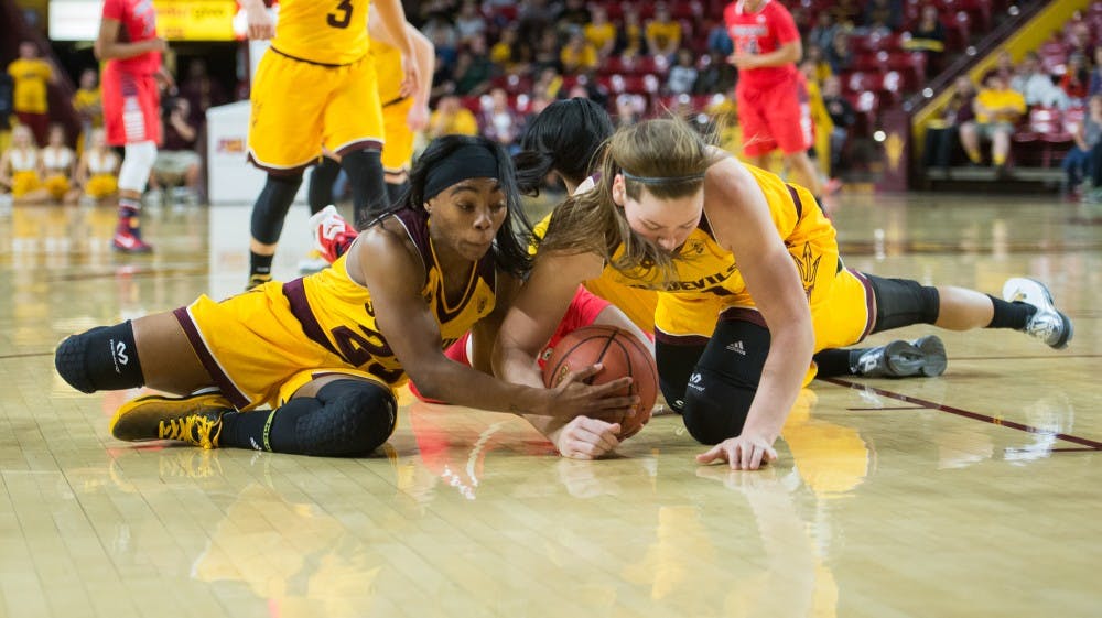 Senior guard Elisha Davis (left) and junior forward Sophie Brunner take possession of the ball from Arizona on Friday, Jan. 22, 2016, at Wells Fargo Arena in Tempe. The Sun Devils defeated the Wildcats 61-49.