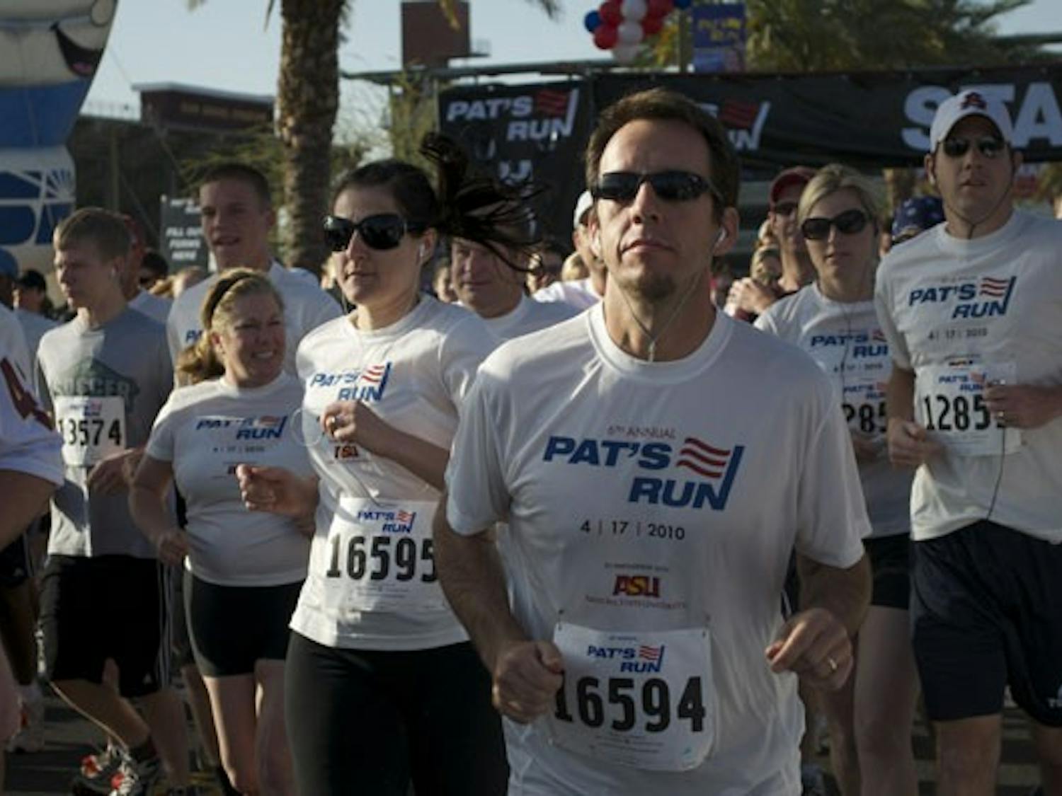 HONORING NO. 40: Runners decked out in their "6th Anuual Pat's Run" T-shirts start the 4.2 mile Run/Walk on the ASU campus Saturday morning. (Photo by Molly Smith)