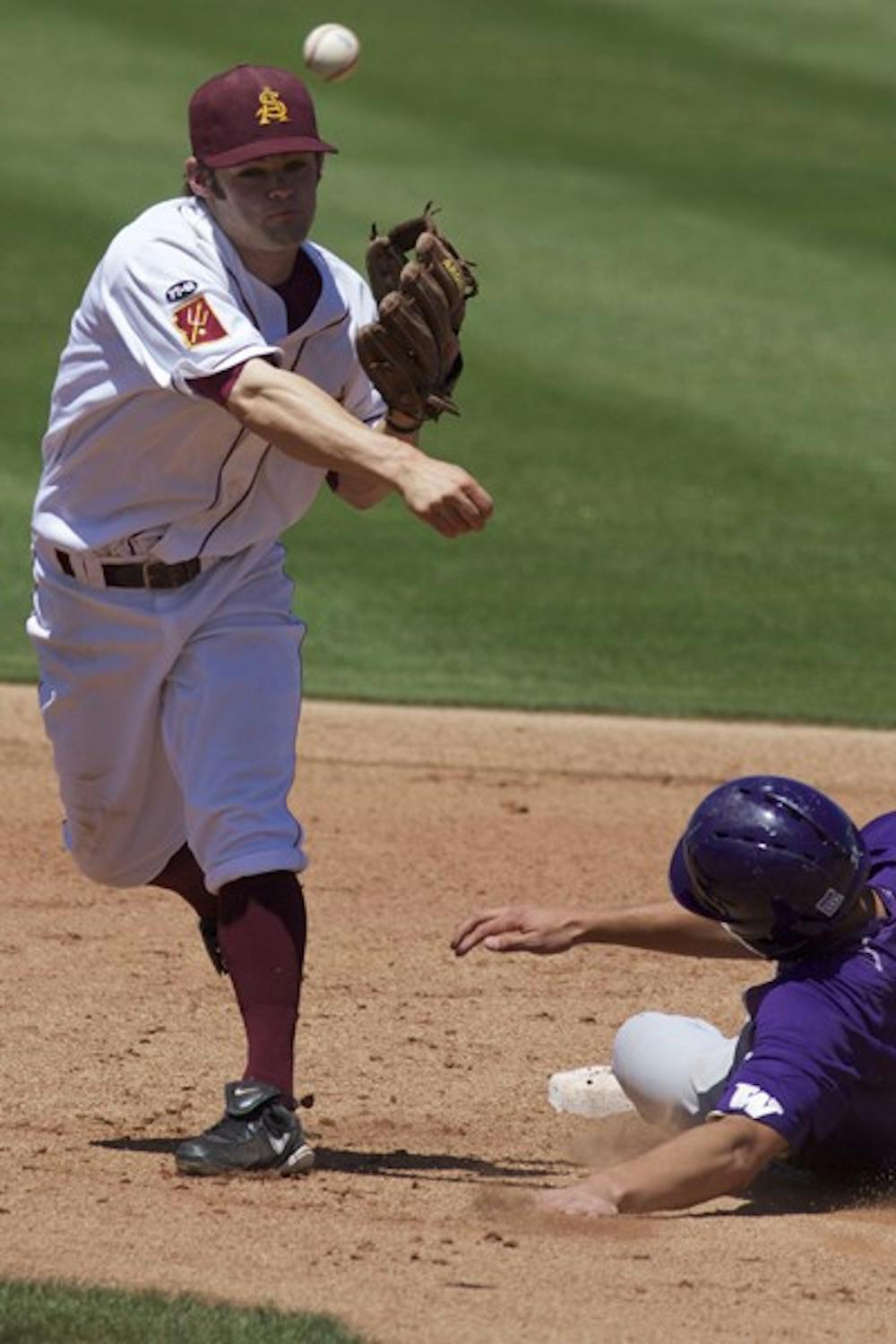 Turning Two: ASU junior Zack MacPhee attempts to turn a double play during a game against Washington last season. The infielder leads a highly ranked Sun Devil squad against a deep 2011 Pac-10 conference. (Photo by Scott Stuk)