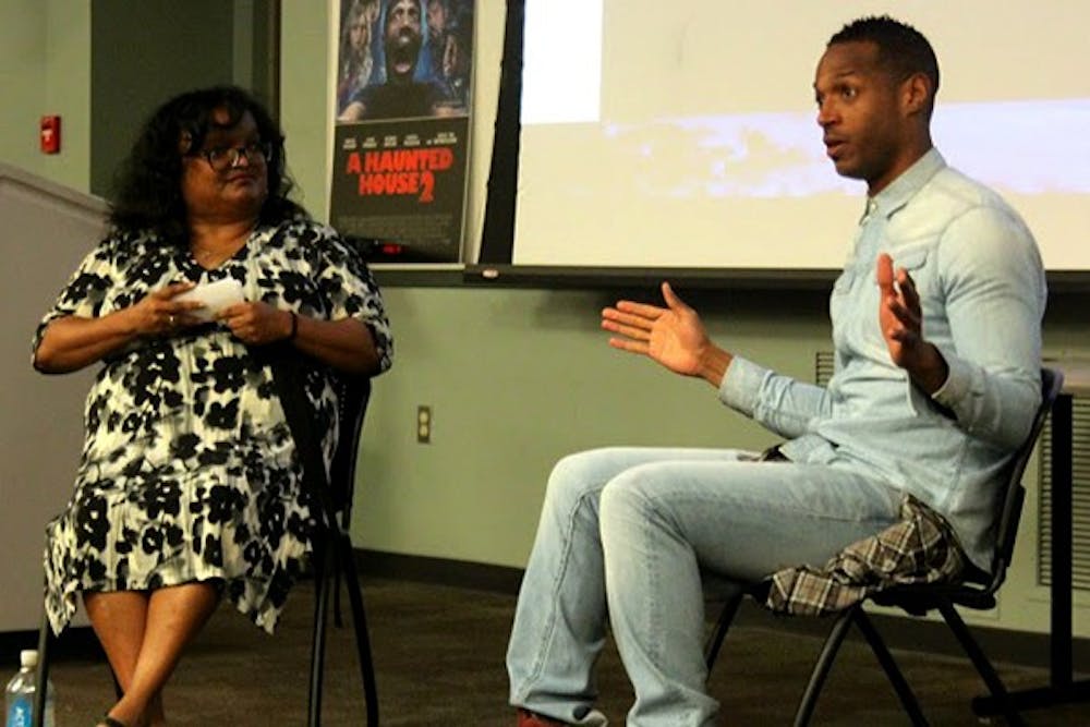 Marlon Wayans and ASU’s Film and Media Studies Professor Bambi Haggins discussed on Wednesday at his Q&A session his belief that everything happens for a reason, including his setbacks, which help shape him into the person he is today. (Photo by Brittany Schmus)