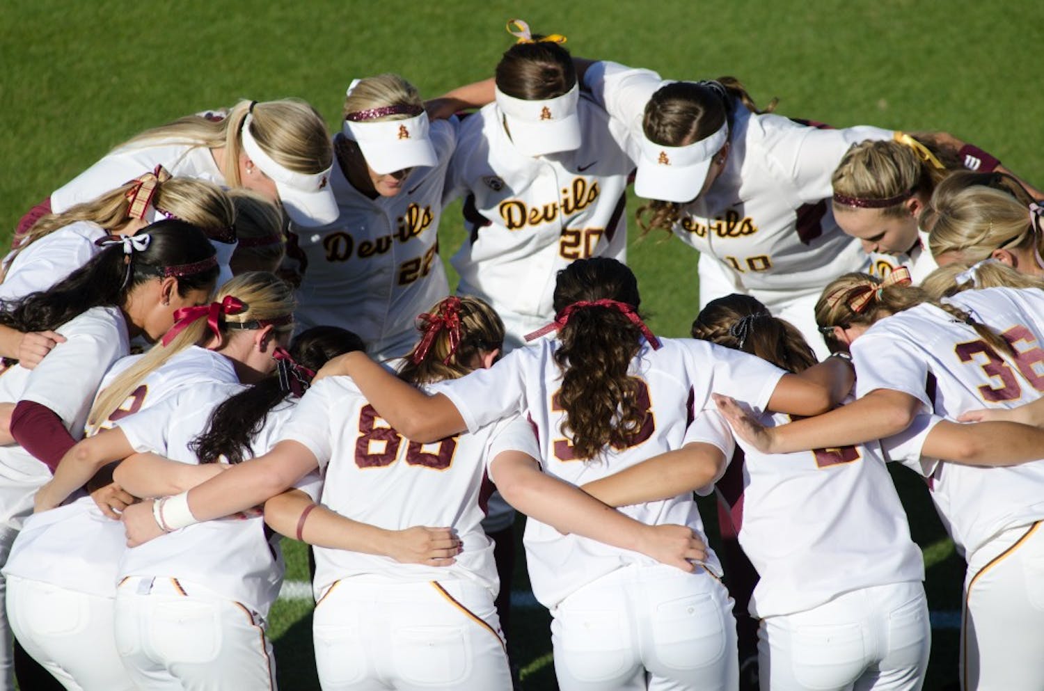 HUDDLE-UP: Members of the ASU softball team huddle before regional play against South Dakota State on May 21. ASU Softball will be traveling to Oklahoma City this week to play in the college World Series.  (Photo by Aaron Lavinsky)