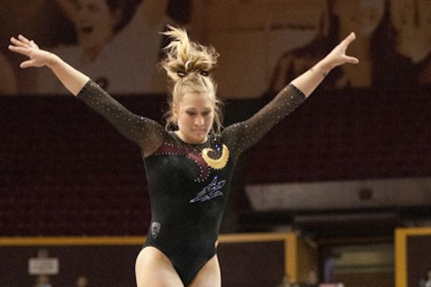 Senior Amelia Rew at a Jan. 12 meet against Oklahoma. This Friday, the Gym Devils head to Utah to face the third ranked team. (Photo by Molly J Smith)