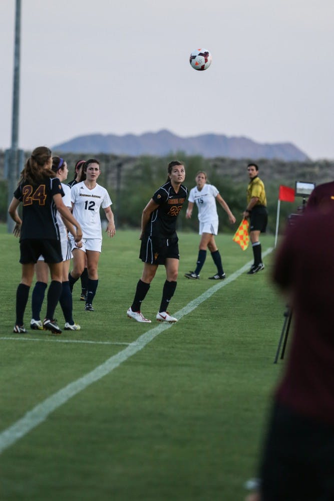 Freshman Larisa Staub watches as the ball goes out of bounds. (Photo by Katie Dunphy)