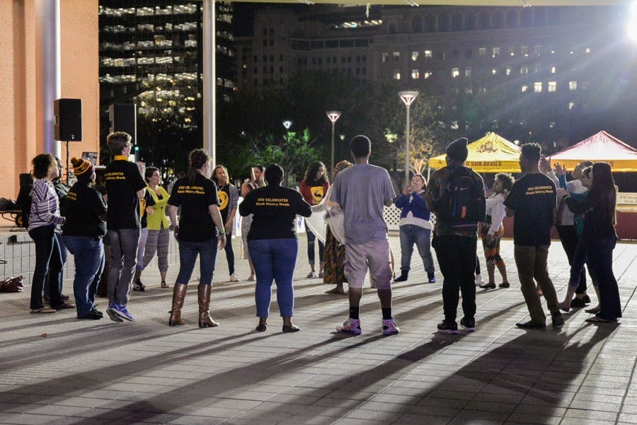 The crowd takes a turn on stage as an impromptu lesson in traditional African dance is given by the dance troupe. This interactive artistic and cultural experience was just one of the many treats enjoyed by attendees of the 2015 SoulFest at ASU's Downtown campus on Wednesday. (J. Bauer-Leffler/The State Press)