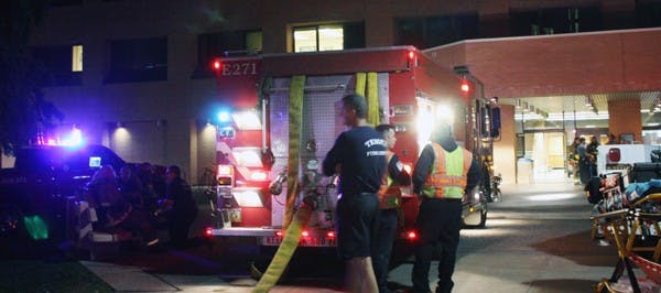 Tempe Fire crews rushed to the Bateman Physical Sciences F-wing as smoke was spotted in the hallway of the basement on Wednesday evening. Officials said the smoke came from compressor leak in the equipment room which spat hot oil and supplies. (Photo by Shawn Raymundo)
