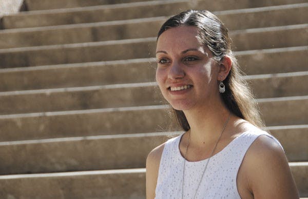 Meghan Moloney, chemical engineering graduate student at ASU, advises a club that teaches the fundamentals of science to middle school students at Lowell Elementary school. (Photo by W. Scot Grey)