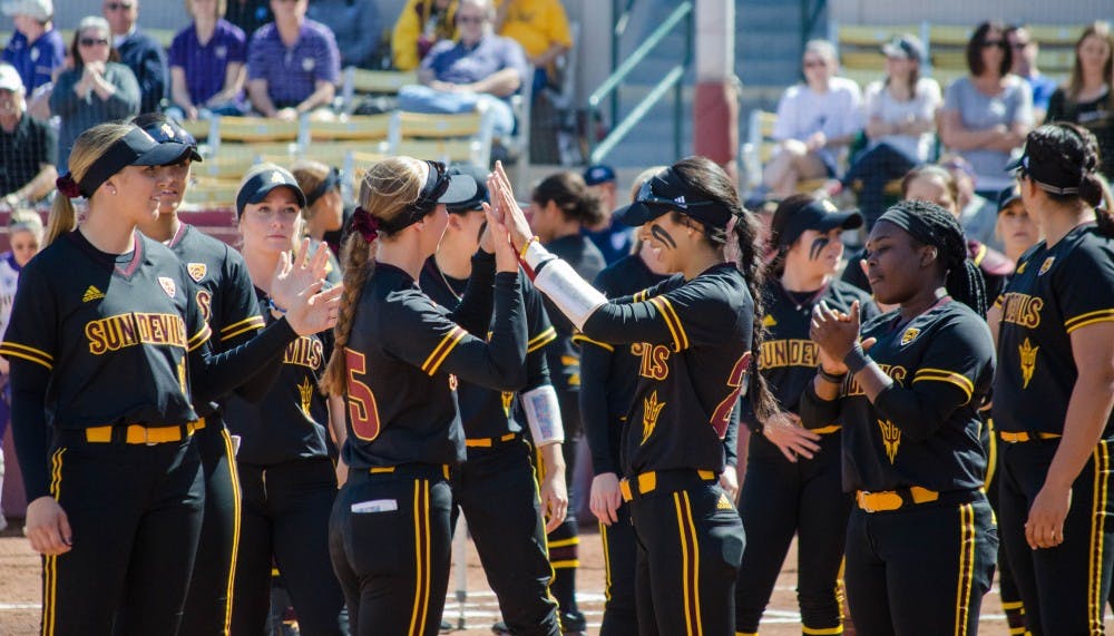 ASU Women's Softball teammates cheers each other on before the game at the ASU vs. Washinton game at the Alberta B. Farrington Stadium in Tempe, Arizona on Sunday, March 18, 2018.