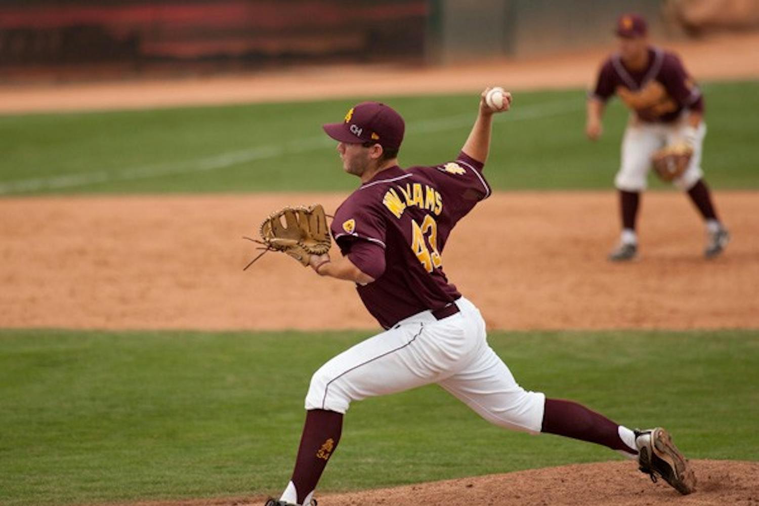 Surprise weekend: ASU freshman Trevor Williams delivers a pitch during the Sun Devils 7-3 loss to Delaware on Friday. ASU travels to Surprise on Thursday for the annual Coca-Cola College Baseball Classic. (Photo by Lisa Bartoli)