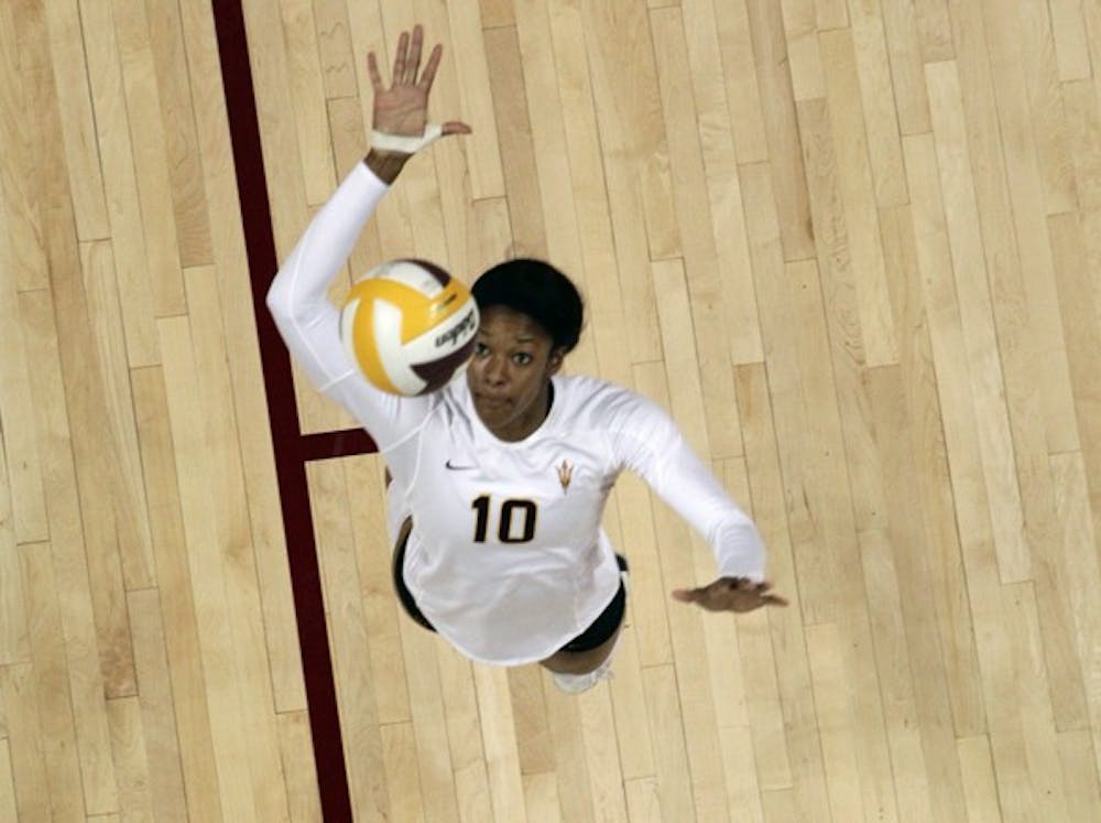 STILL UPBEAT: ASU junior Erica Wilson leaps for a jump serve during the third set against Stanford on Saturday. Wilson says the team is still optimistic despite a 5-16 record. (Photo by Beth Easterbrook)