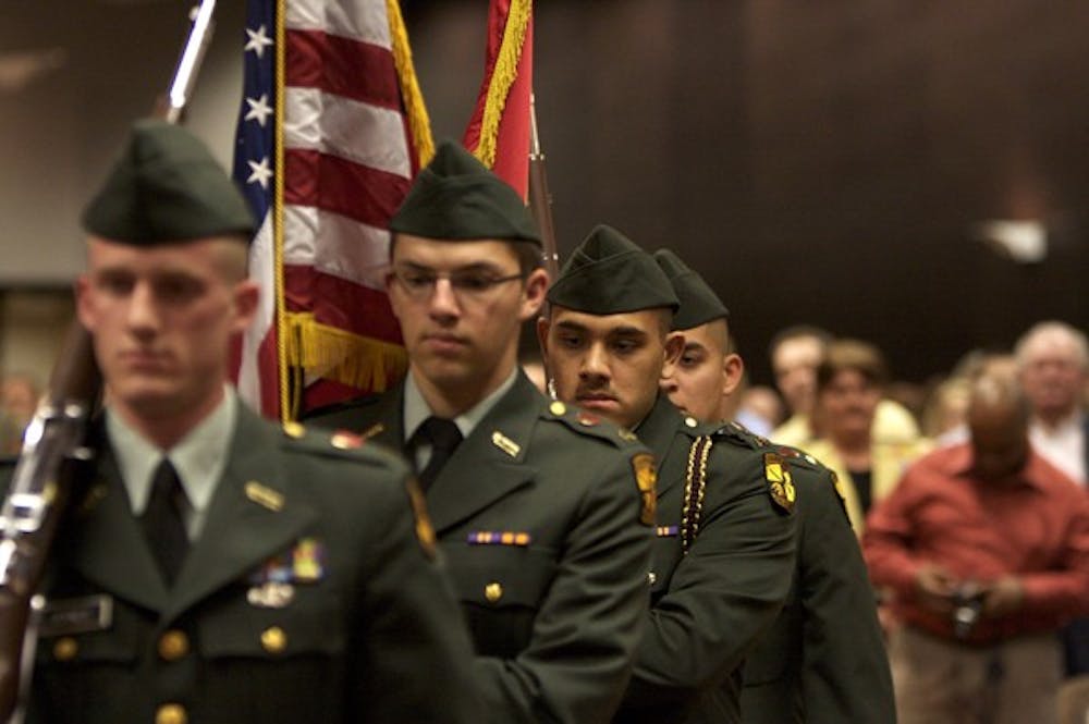 ROTC COMMENCEMENT: Members of the Army ROTC color guard march in the U.S. and Arizona flag during the Spring commencement. (Photo by: Scott Stuk)