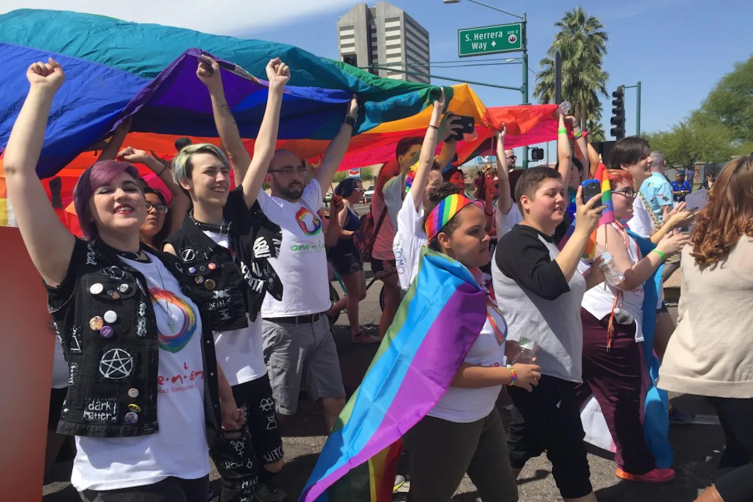 Participants march at the annual Pride Parade on Sunday, April 12, 2015, in downtown Phoenix. 
