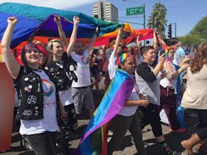 Participants&nbsp;march at the annual Pride Parade on Sunday, April 12, 2015, in downtown Phoenix.&nbsp;