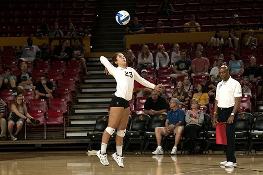 Sophomore libero Mia Mazon serves the ball in a match against Pepperdine in a home game at Wells Fargo Arena on Saturday Sept. 20, 2014. (Photo by Mario Mendez)
