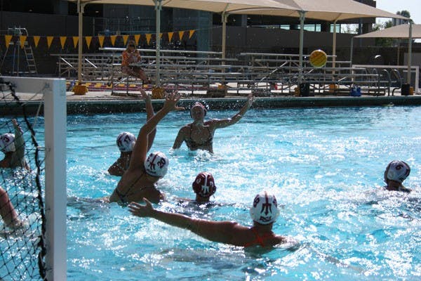 HANDS UP: The ASU water polo team runs through practice at the Mona Plummer Aquatic Center earlier this week. (Photo by Kyl Thompson)