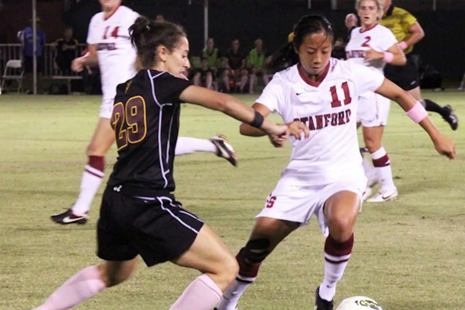 OVERWHELMED: ASU redshirt sophomore Nicki Stone tries to knock the ball away from junior defender Rachel Quon during Stanford’s 3-1 victory on Friday. Stanford used a strong possession game to frustrate the Sun Devils and cruise to the win. (Photo by Rosie Gochnour)
