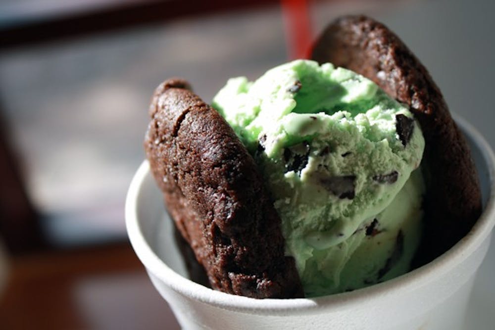 Mint chocolate chip ice cream is squeezed between two soft, homemade double chocolate cookies at the new, family-owned ice cream sandwich shop, Slickables, on Mill Avenue in Tempe. (Photo by Jessie Wardarski)