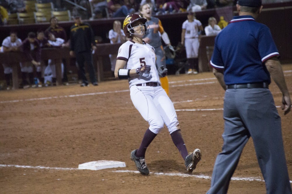 Senior Jennifer Soria slows herself after running past first base.