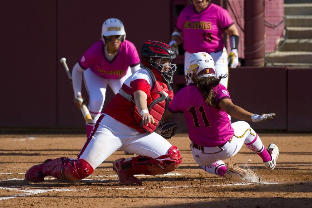 ASU senior shortstop Chelsea Gonzales (11) is tagged out at home by Utah catcher Kelly Martinez during game two of a softball series versus the no. 10 ranked Utah Utes at Alberta B. Farrington Softball Stadium in Tempe, Arizona on Saturday, April 22, 2017. ASU lost 7-6.