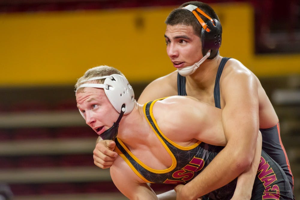 Senior Matt Kraus and Oregon State's Abraham Rodriguez await the official signal at the beginning of the second period on Friday, Jan. 29, 2016 at the Wells Fargo Arena in Tempe.
