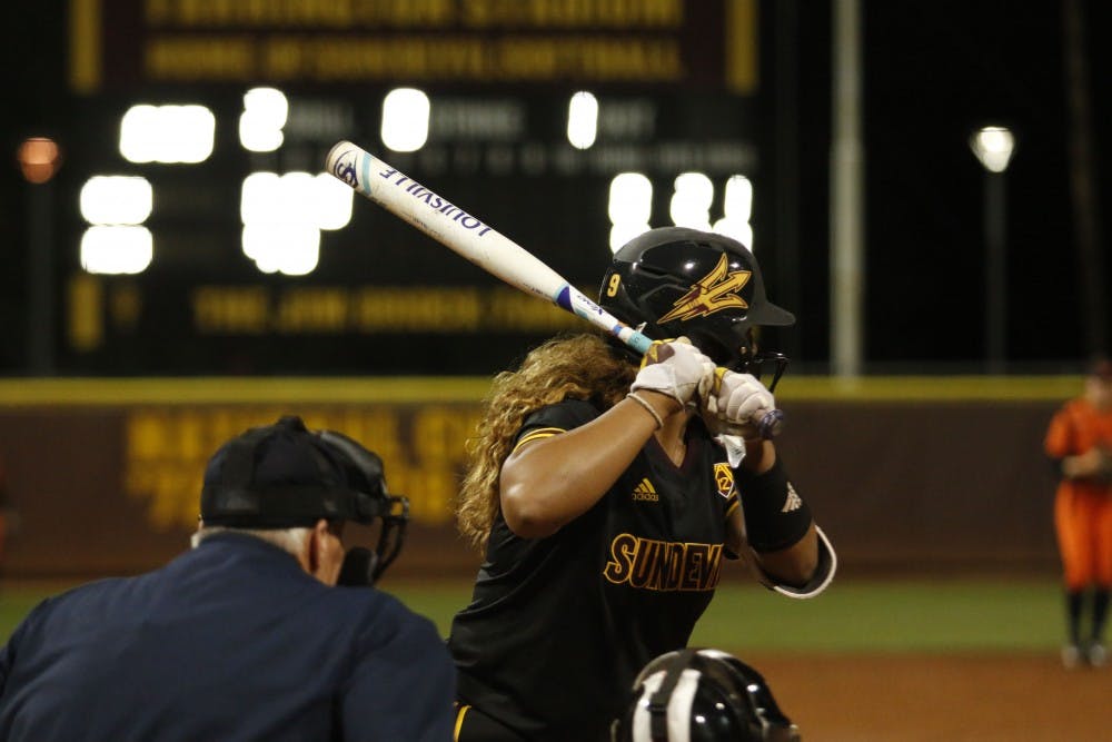 ASU sophomore outfielder Ulufa “Fa” Leilua (9) is up to bat ASU redshirt junior 3rd base Marisa Stankiewicz (20) runs to home after hitting a home run in a softball game versus Oregon State University at Alberta B. Farrington Stadium in Tempe, Arizona on Sunday, March 26, 2017. The Sun Devils won the game 11-0.