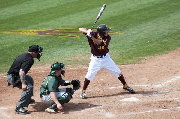 Redshirt sophomore outfielder Trever Allen pushes his weight on his right foot to prepare to swing against Oregon on April 7. Allen seems to be more confortable in batters boxes away from home. (Photo by Molly J. Smith)